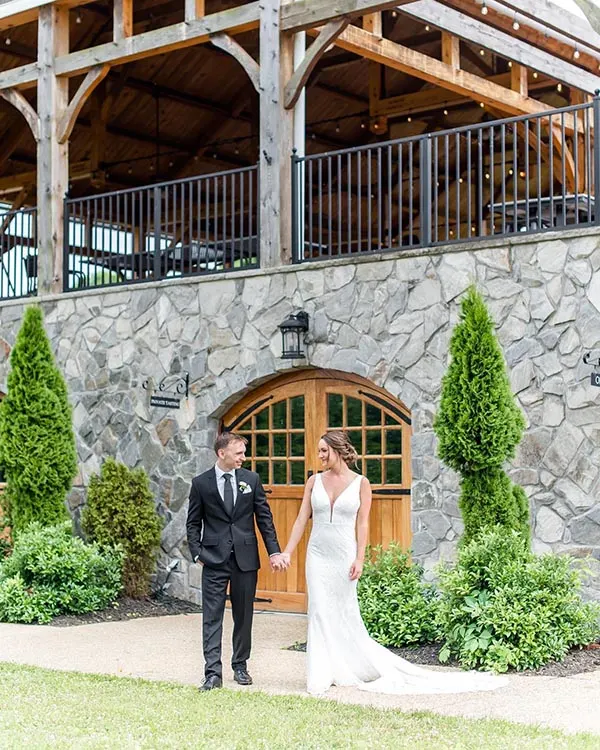 Wedding photos in front of Creek's Edge Winery.