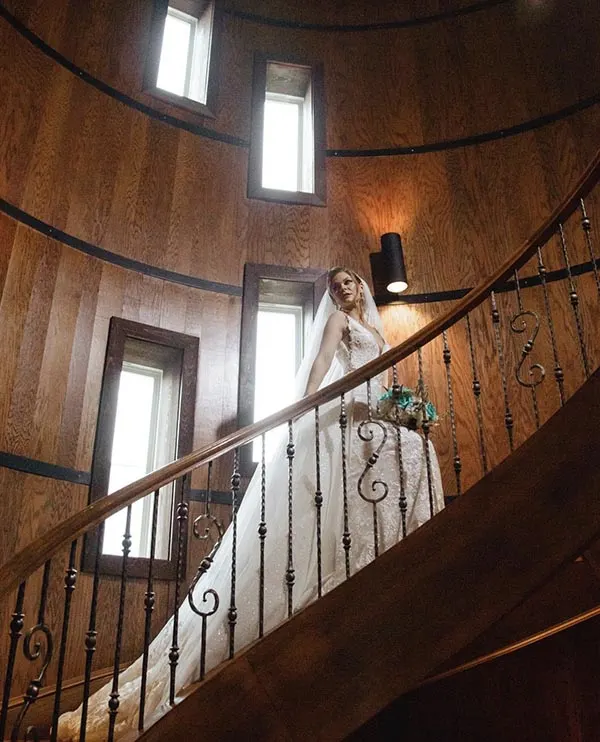 A bride in the spiral staircase at Creek's Edge Winery.