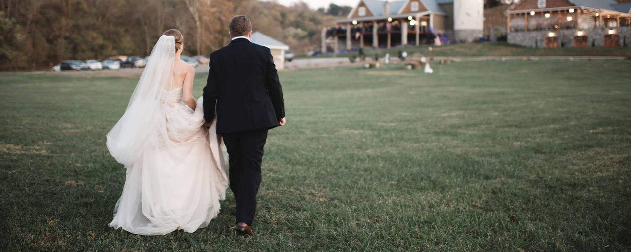 Wedding photos in front of Creek's Edge Winery.